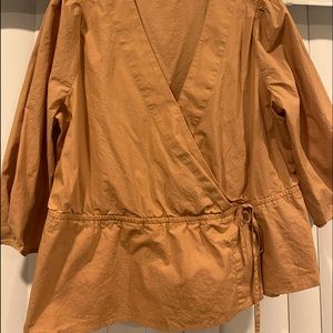 Faux wrap blouse with a full long sleeve… color is a dark peach color